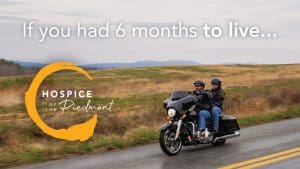 A hospice patient rides on the back of a motorcycle in hospice of the piedmont's campaign to shift hospice perceptions. The tagline "If you had six months to live..." is written across the top.