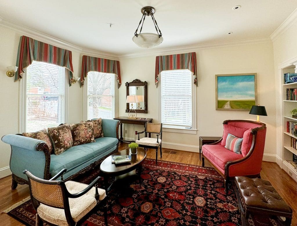 Renovated hospice house parlor with antique furniture