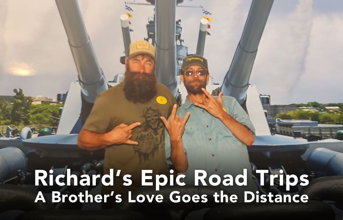 Two brothers, one with a long beard the other with a short beard stand on the deck of the USS North Carolina