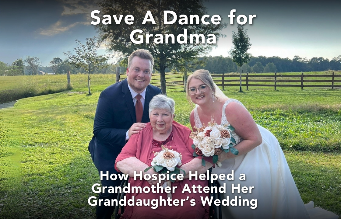 A hospice patient wears a soft-pink dress and sits in a wheelchair. She is flanked by a bride in a wedding dress (her granddaughter) and a groom in a suit.